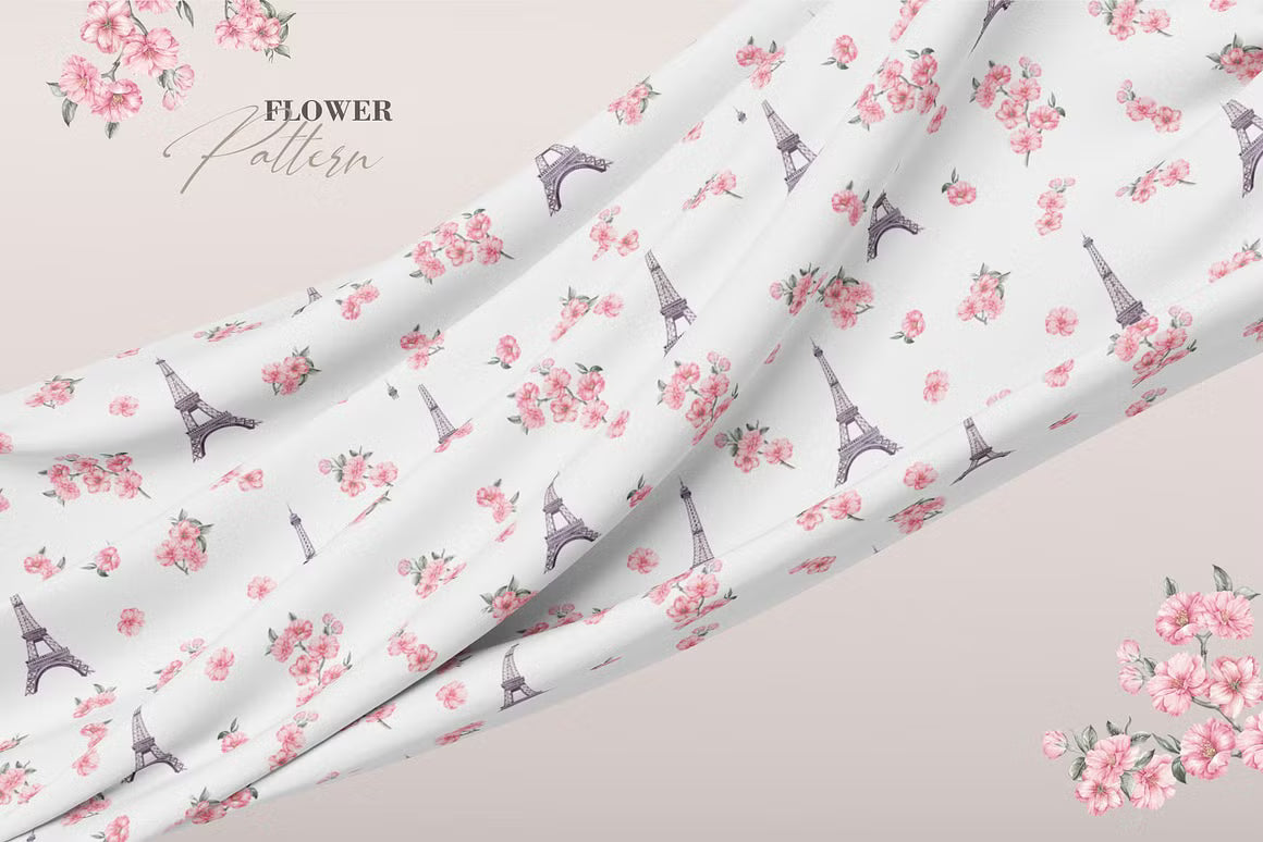 Repeating pink floral and Eiffel Tower pattern shown on fabric