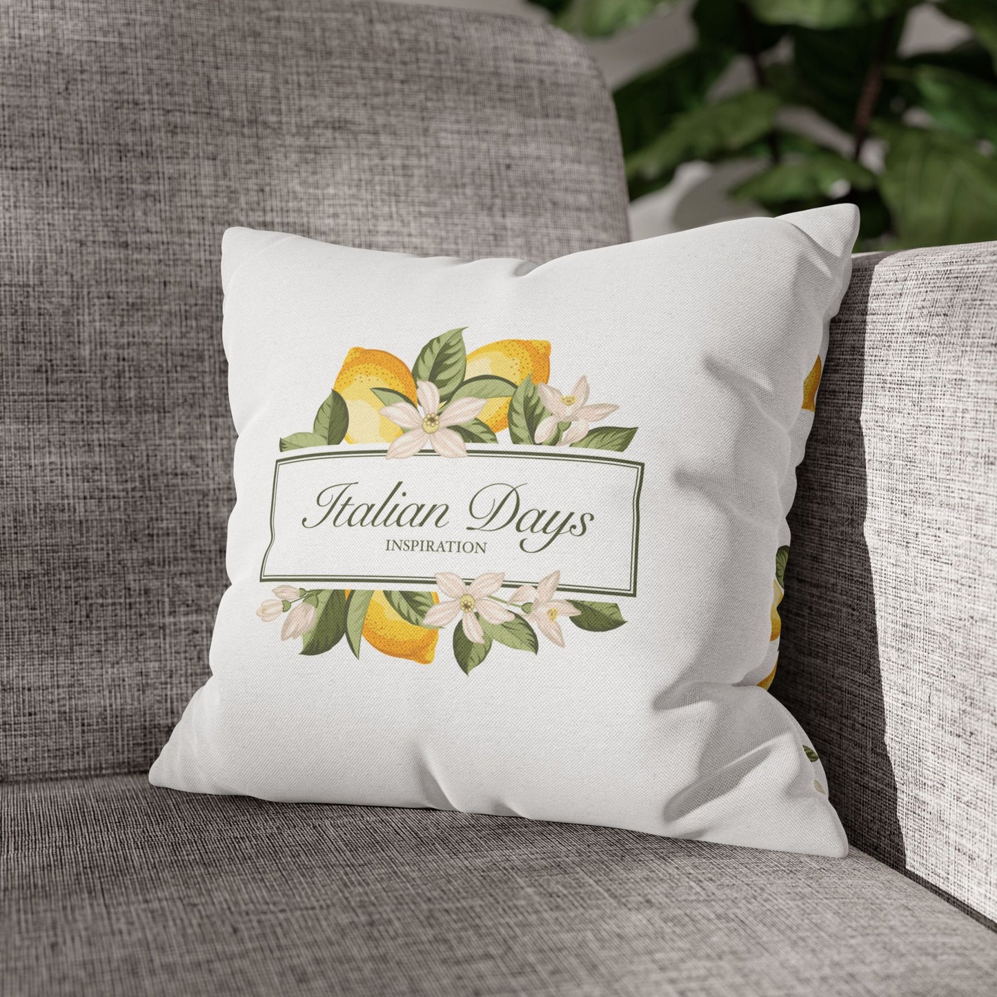 Italian Days lemon botanical pillow cover styled on a gray sofa
