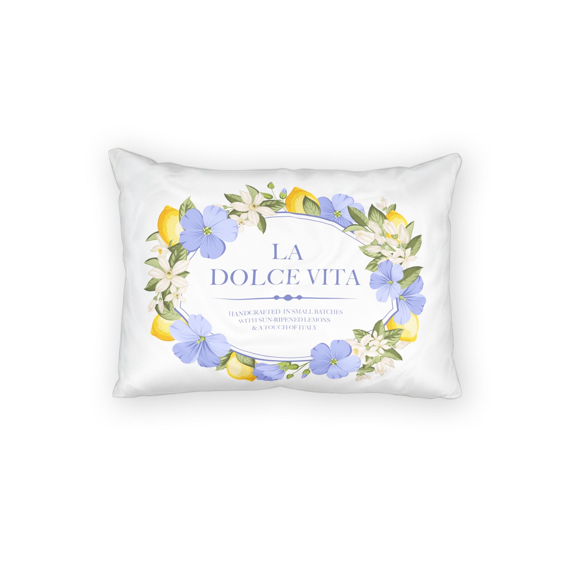 Front flat view of the white cotton pillow sham printed with a lemon and violet floral wreath framing La Dolce Vita text and handcrafted tagline