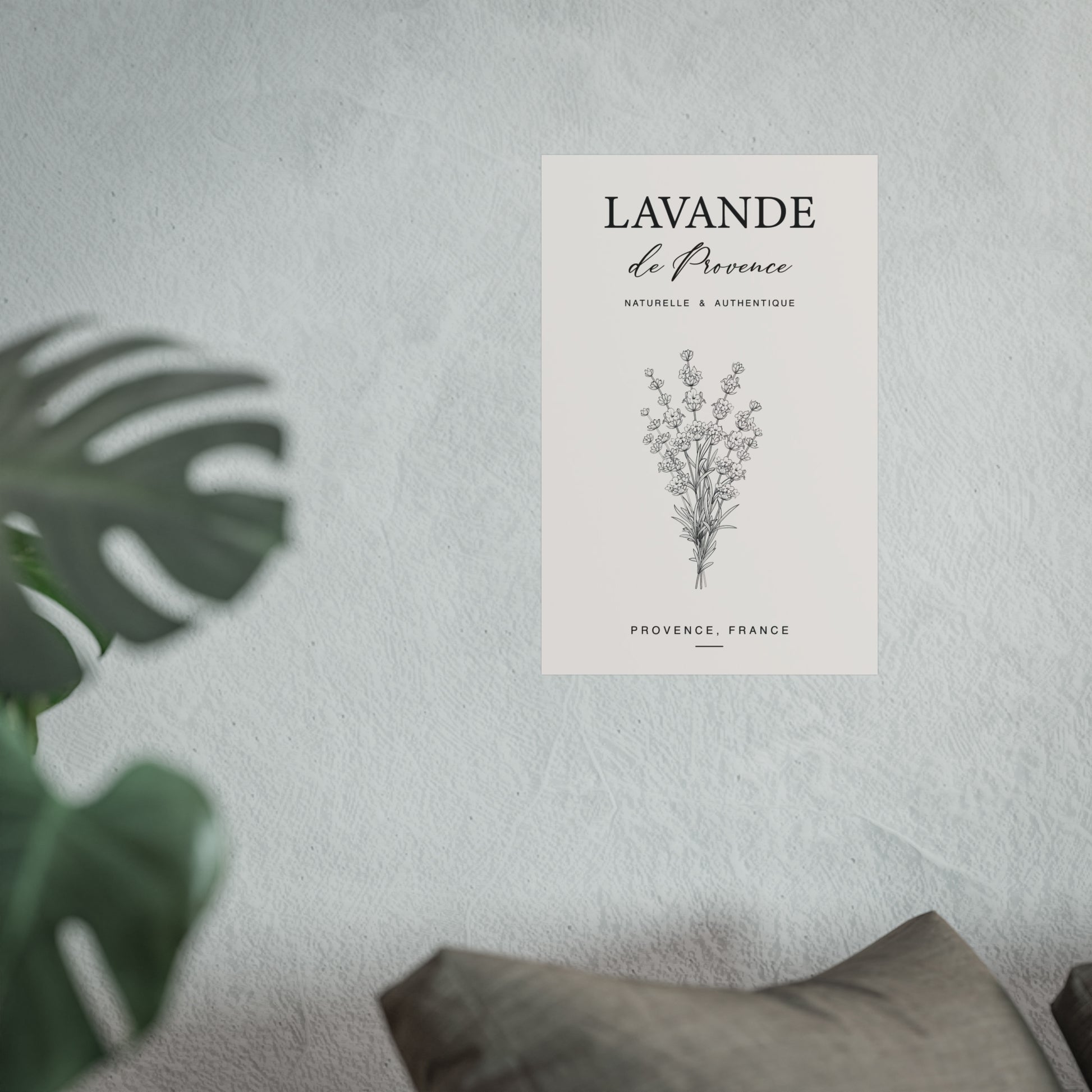 Lavande de Provence botanical print on a light grey wall beside a monstera plant in a minimal interior