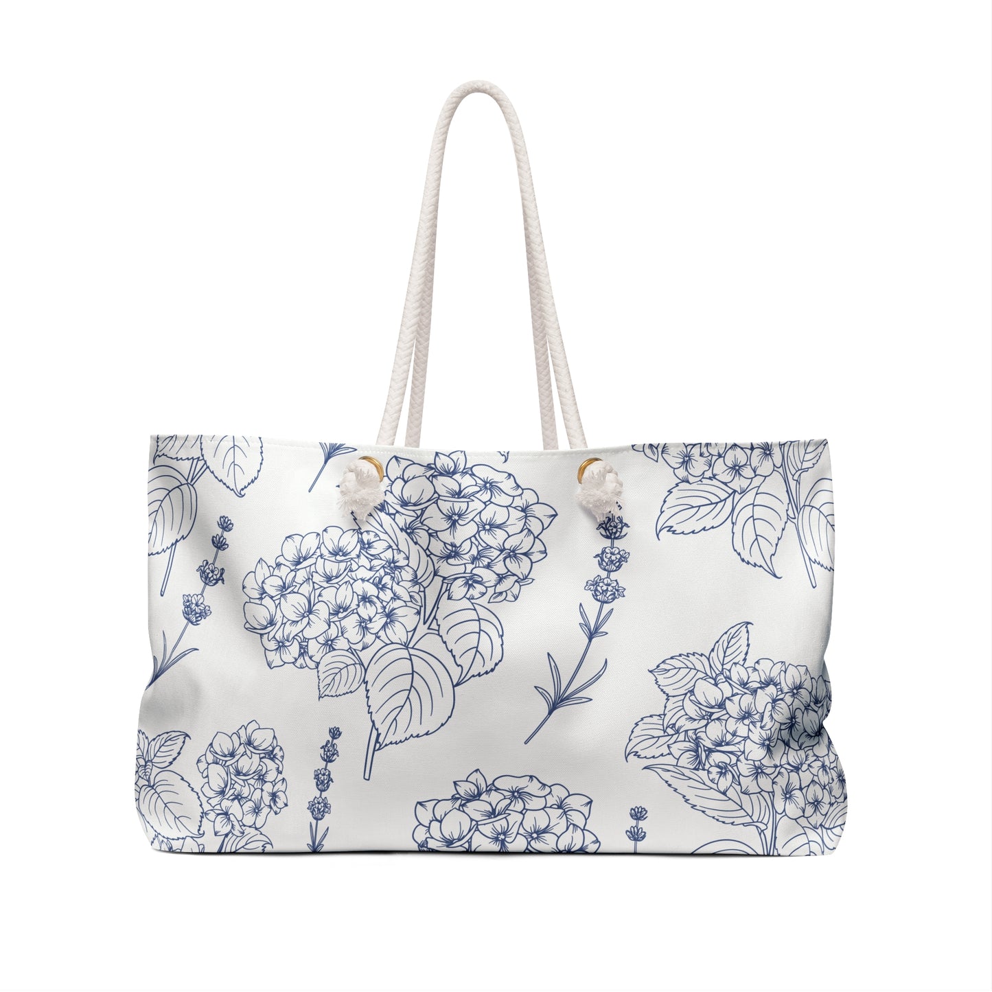 Close-up of the weekender bag front showing detailed lavender and hydrangea botanical pattern in indigo ink on a cream background