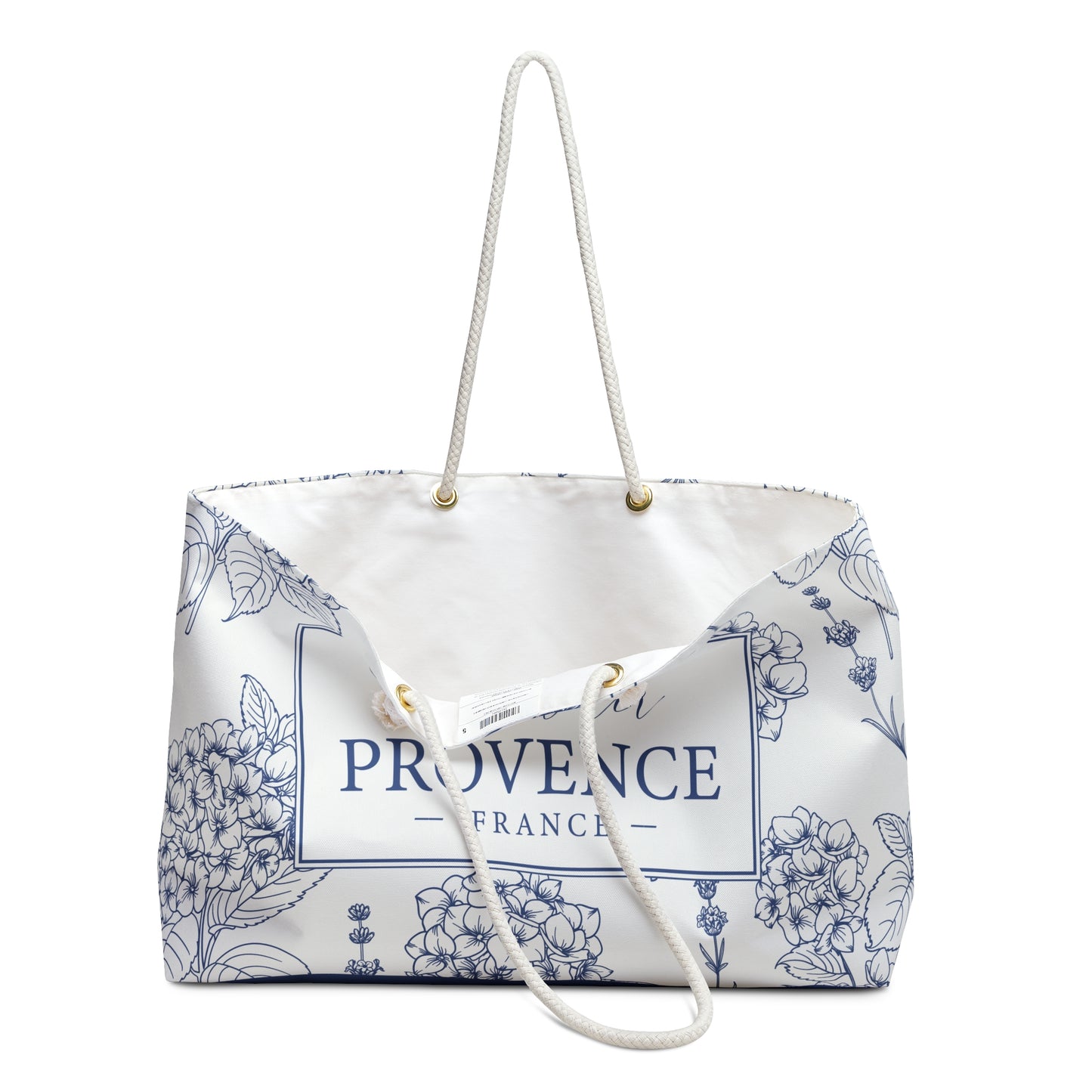 Lavender Provence weekender bag open at the top showing cream-colored interior lining and wooden bead accents
