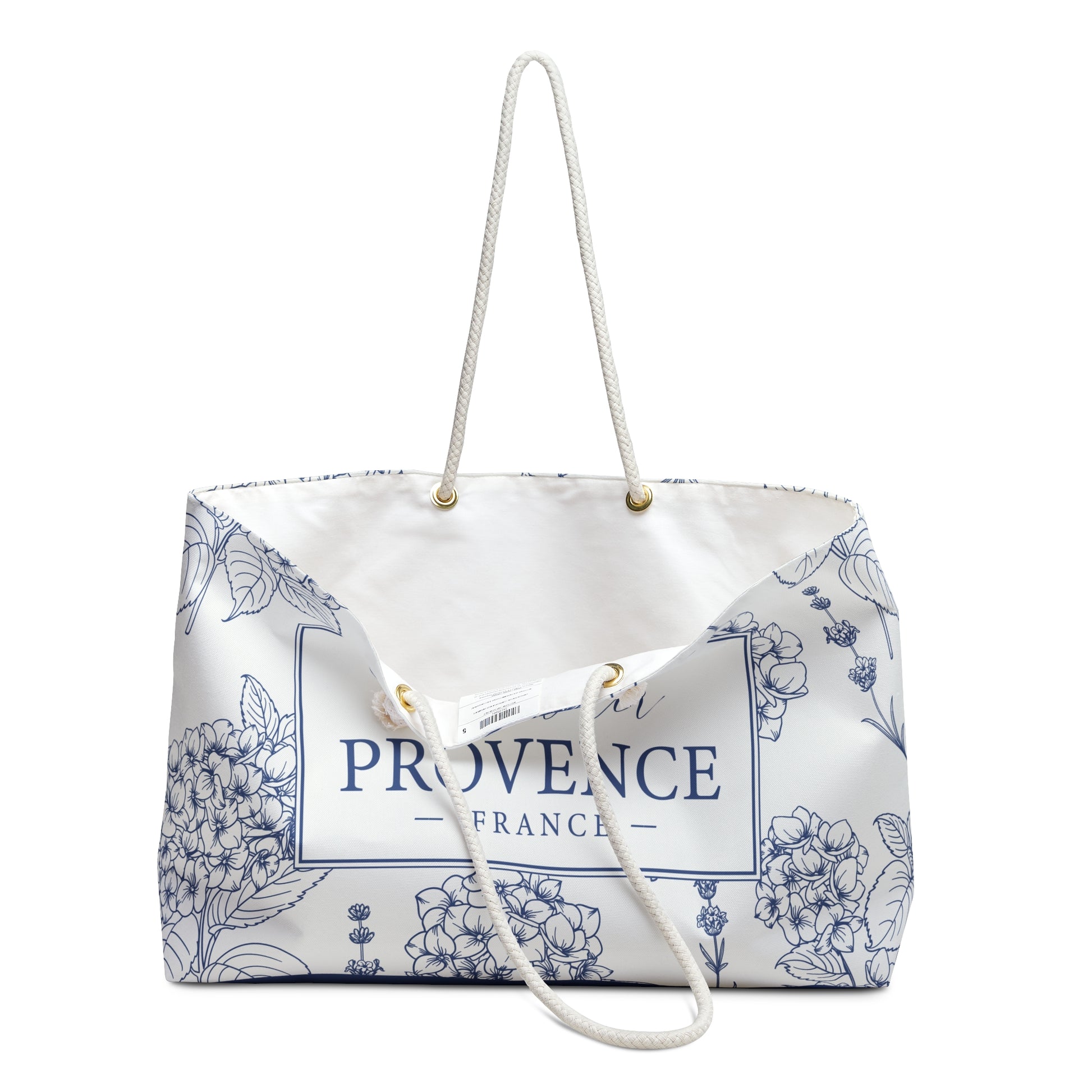 Lavender Provence weekender bag open at the top showing cream-colored interior lining and wooden bead accents