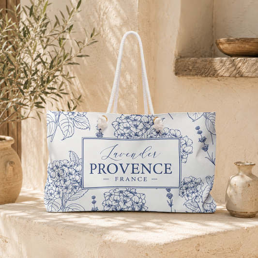 Lavender Provence weekender bag pattern swatch showing indigo botanical line art with lavender sprigs, hydrangea clusters, and leaves on cream background