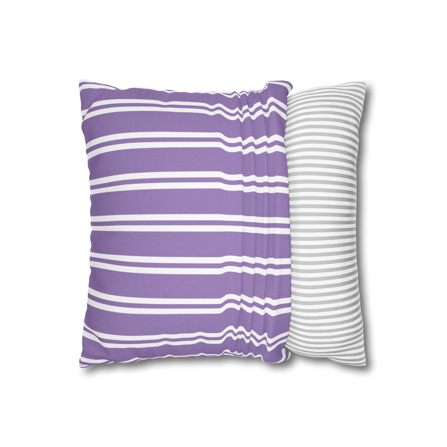 Lavender sprig pillow displayed at three-quarter angle showing purple striped back side and botanical front detail with white piping