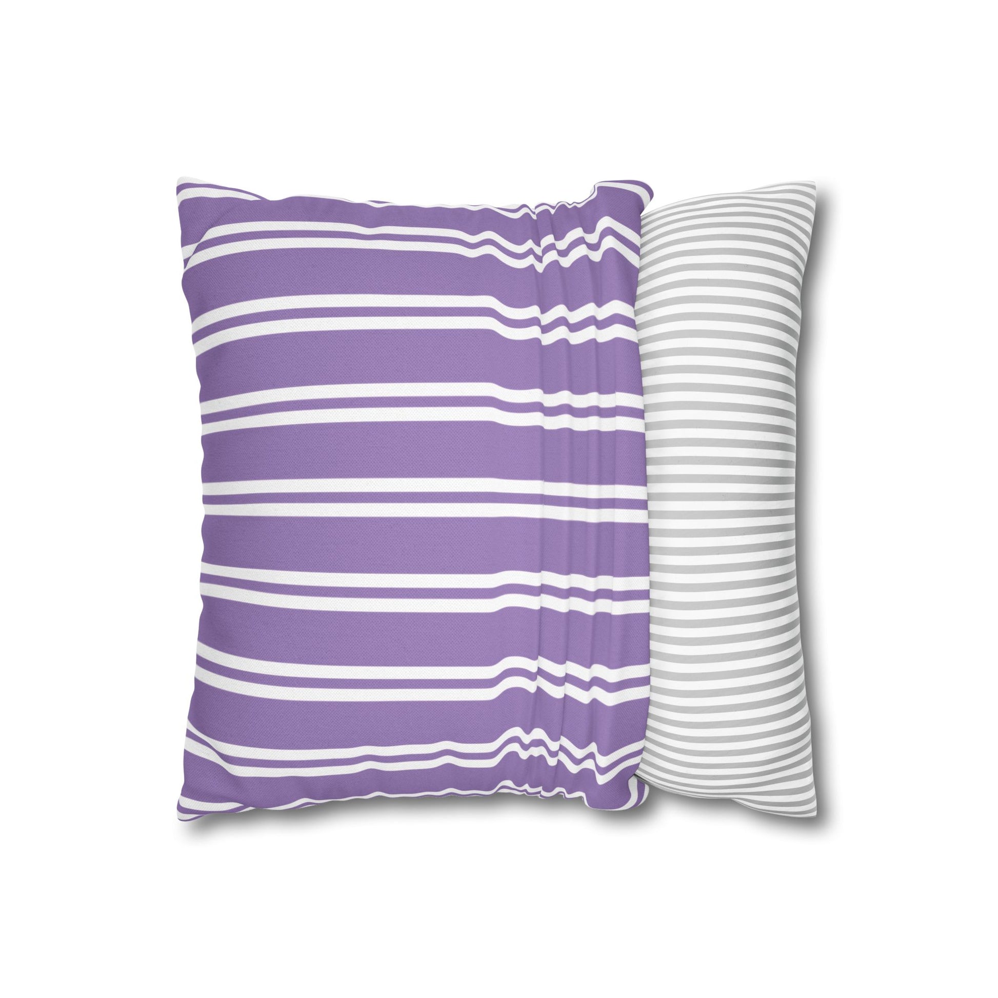 Lavender sprig pillow displayed at three-quarter angle showing purple striped back side and botanical front detail with white piping