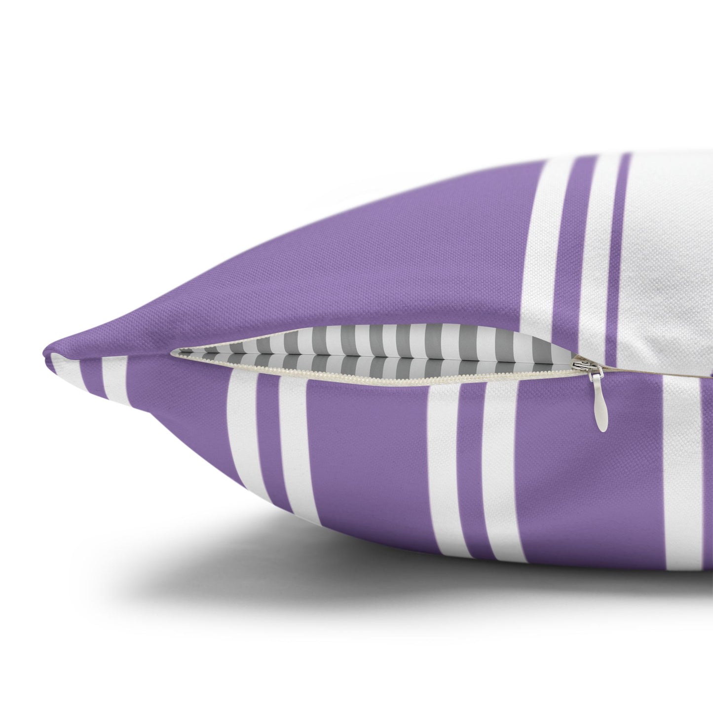 Close-up detail of lavender sprig pillow zipper closure and purple and white striped back panel showing construction