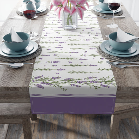 Lavender sprig table runner styled on a dining table with wine glasses and pink lilies