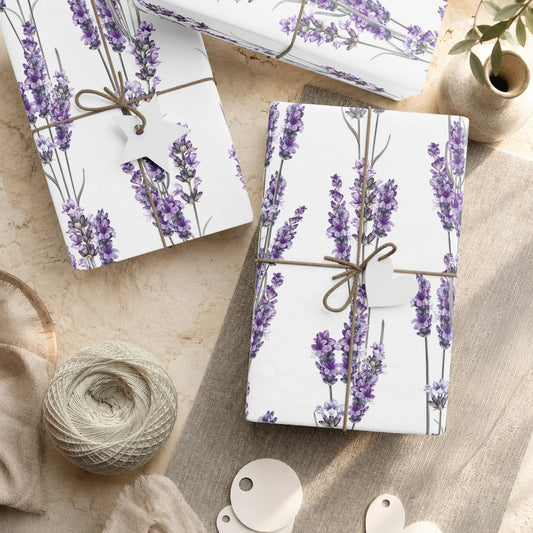 Wrapped gifts in lavender sprig wrapping paper tied with twine and paper tags