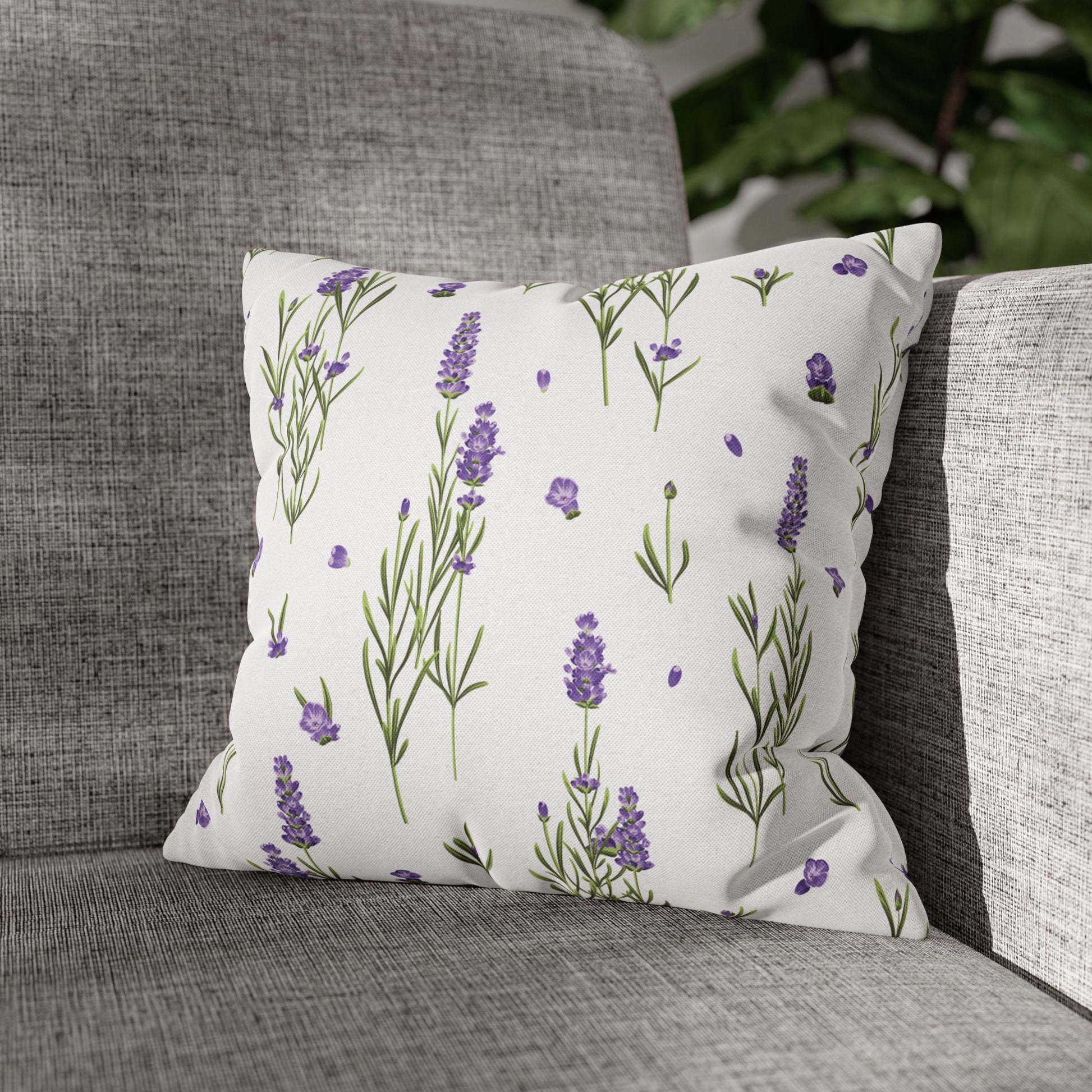 Lavender sprigs pillow displayed on a modern gray upholstered sofa in a contemporary living room setting