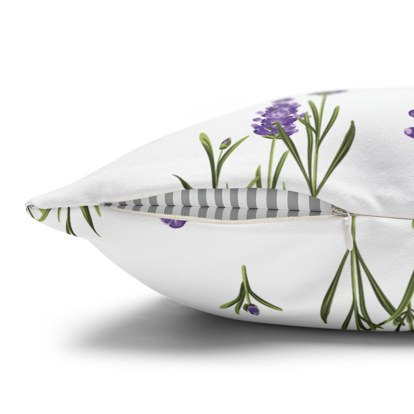 Close-up detail of lavender sprigs pillow showing hidden zipper and gray and white striped fabric back