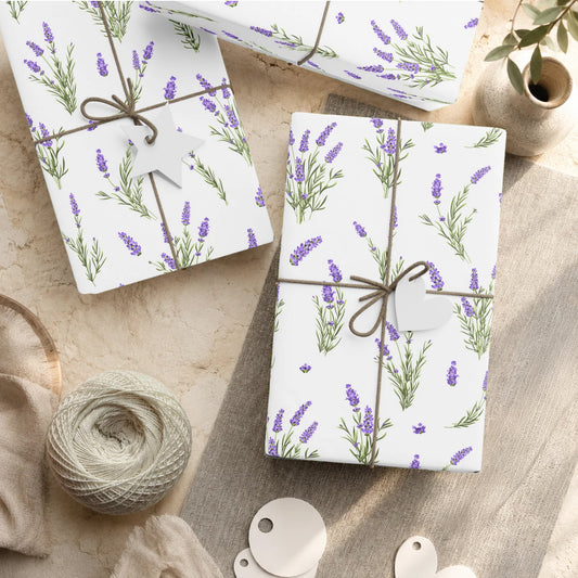 Lavender sprigs wrapping paper styled with wrapped gifts, twine, and gift tags