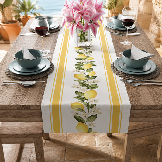 Lemon blossom stripe table runner styled on a dining table with pink lilies and wine glasses