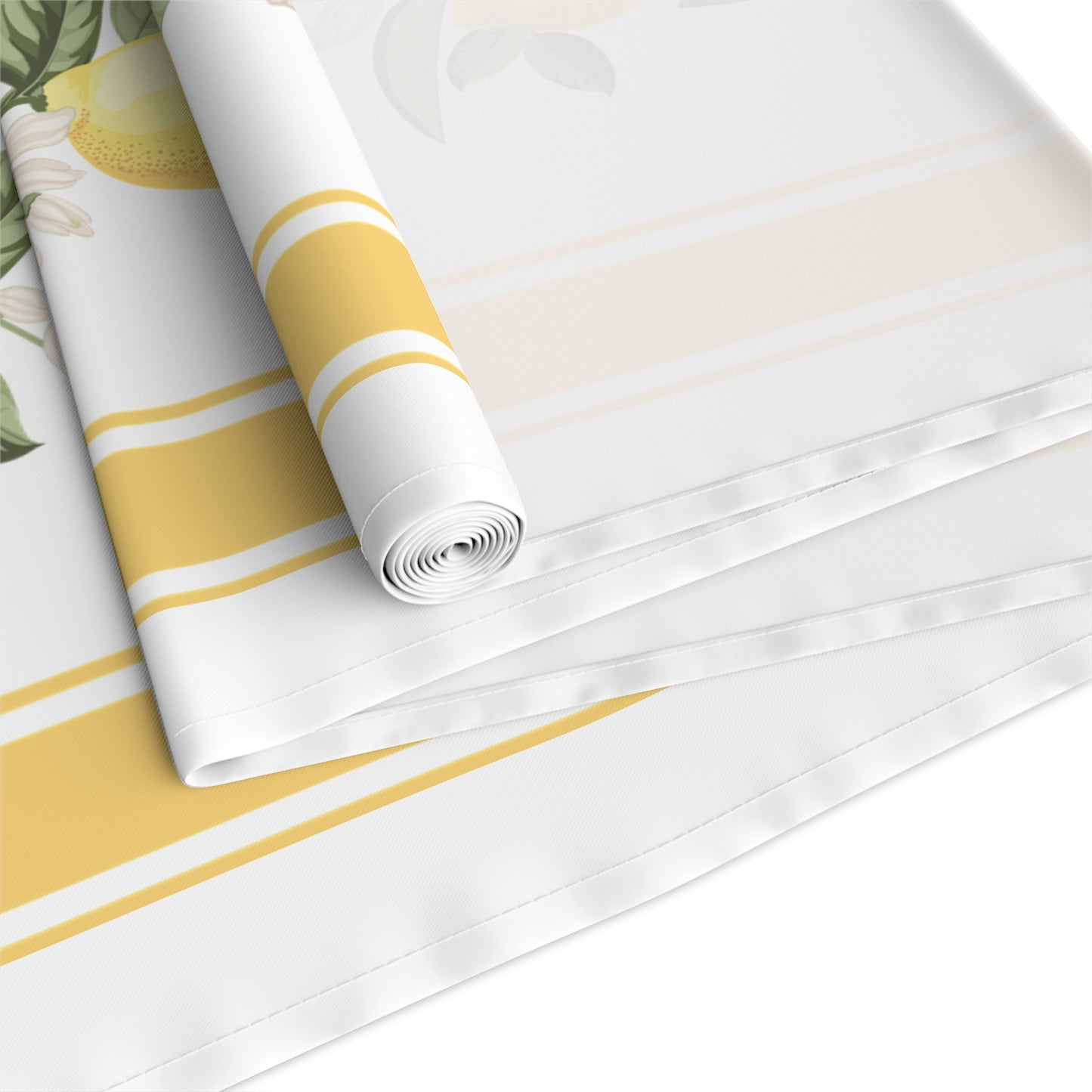 Folded corner of lemon blossom stripe table runner with lemon blossom sprig detail