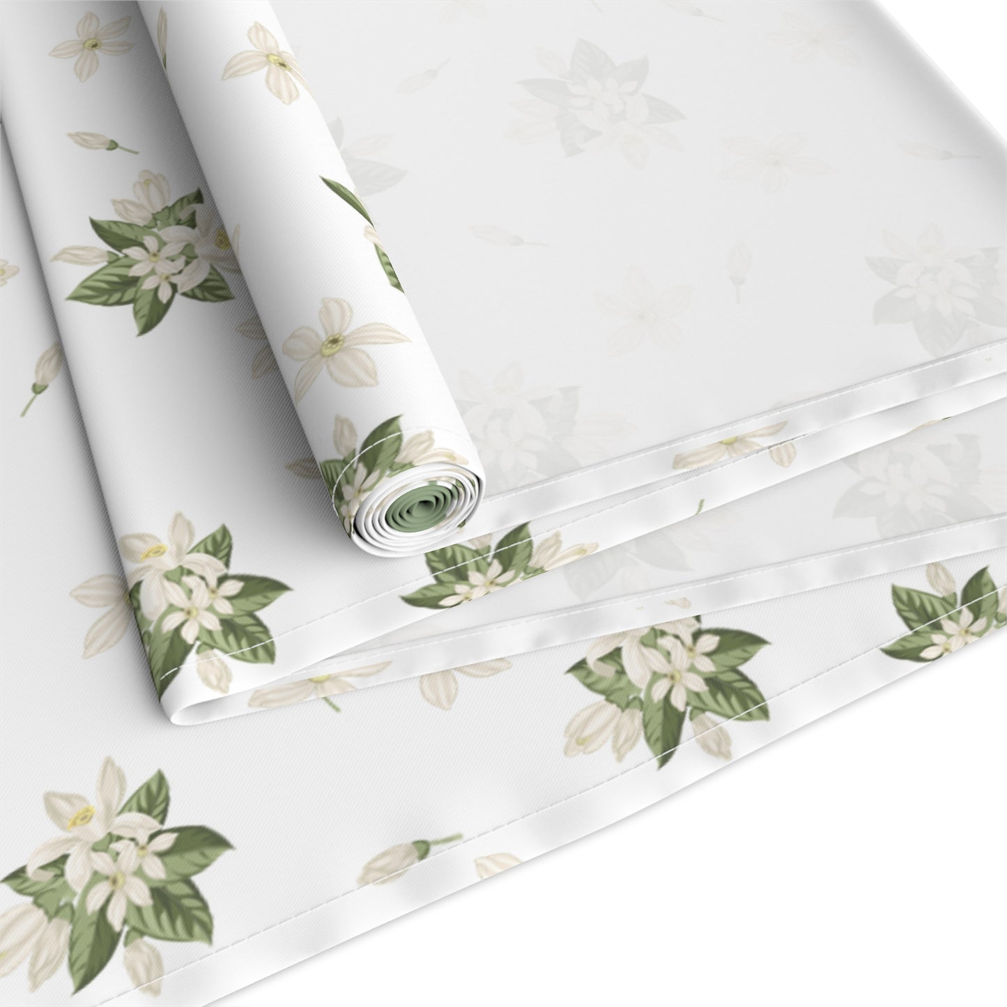 Close view of lemon blossom table runner fabric with rolled edge detail