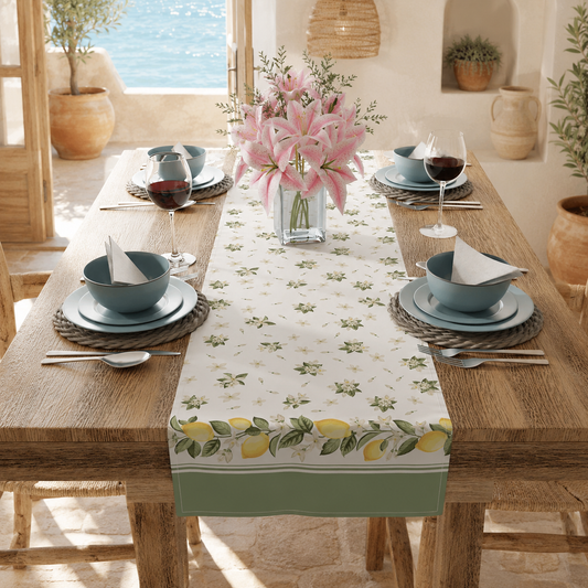 Lemon blossom table runner styled on a dining table with plates and pink flowers