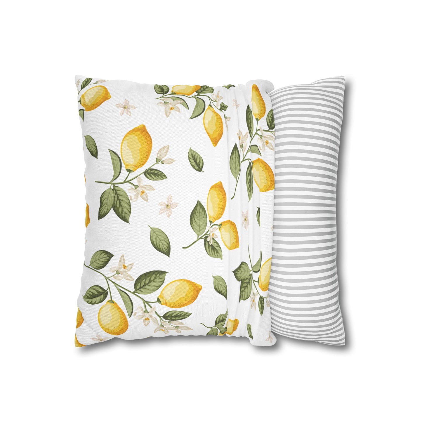 Lemon branch throw pillow shown at an angle displaying the vibrant front pattern and coordinating gray striped back panel