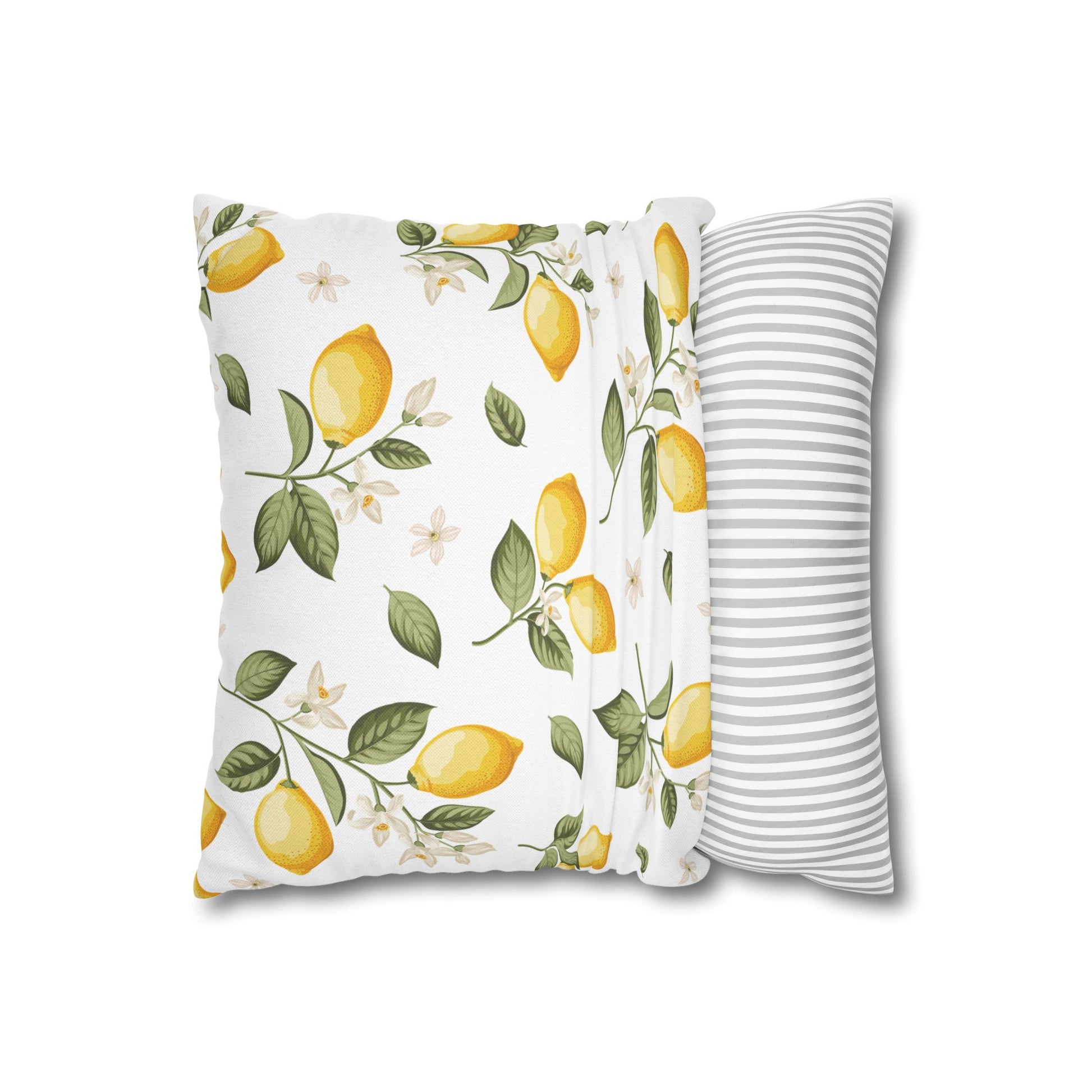 Lemon branch throw pillow displayed flat with front botanical print and back gray striped panel visible