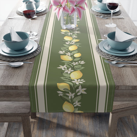 Lemon grove table runner styled on a wood dining table with pink lilies and wine glasses