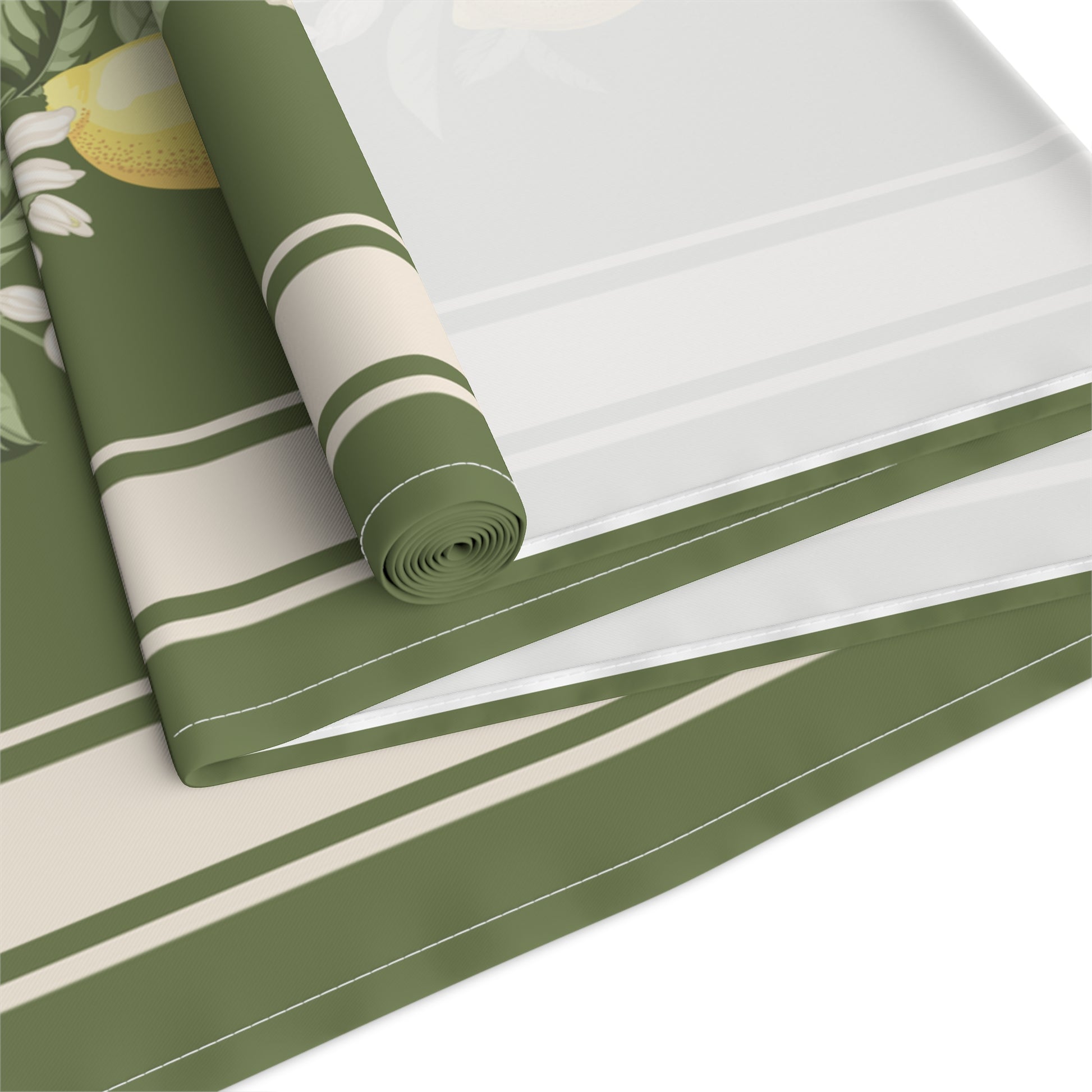 Rolled corner of lemon grove table runner with lemon sprig detail