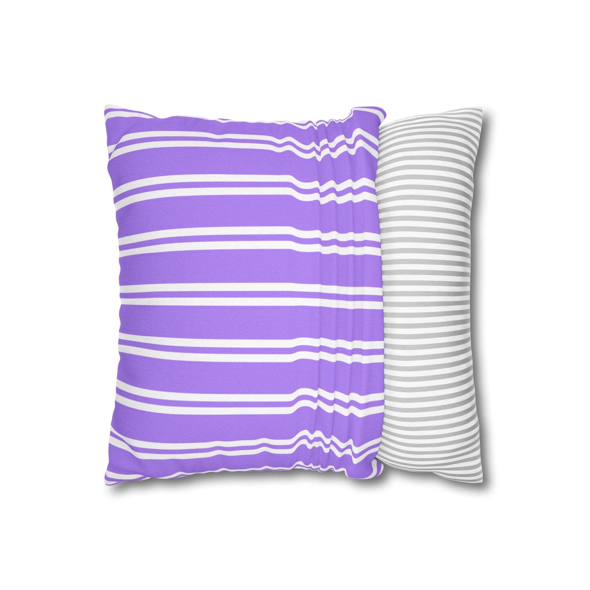 Two-sided view of the throw pillow with bunched center showing purple striped front and gray striped back to display fabric texture and dimension