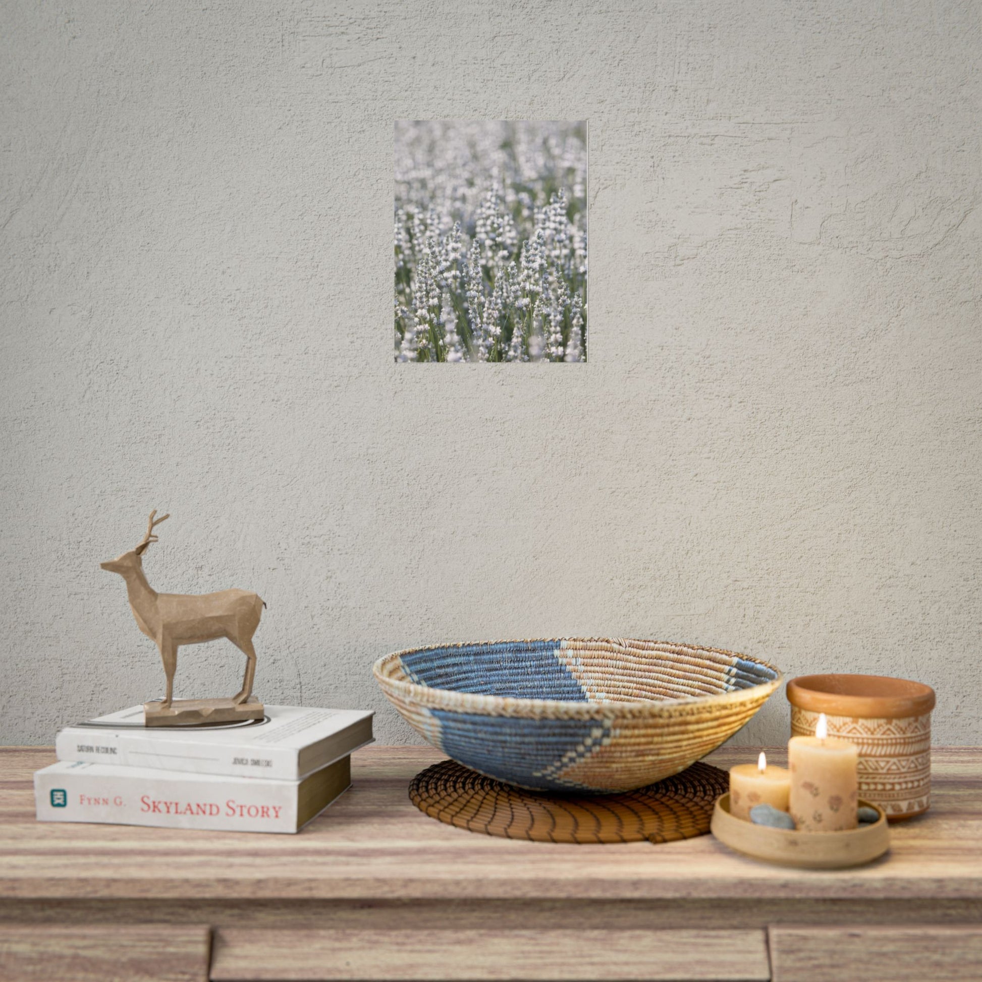 White lavender field botanical print displayed above a shelf with woven basket and candle